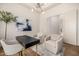 Home office with sleek desk, two chairs, and modern art at 9655 N 130Th St, Scottsdale, AZ 85259