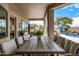 Covered patio with dining area overlooking the pool at 9655 N 130Th St, Scottsdale, AZ 85259