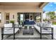 Modern patio furniture with view into the living room at 9655 N 130Th St, Scottsdale, AZ 85259