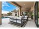 Covered patio with comfortable seating and view of pool at 9655 N 130Th St, Scottsdale, AZ 85259