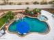 Relaxing pool with blue umbrella and spa at 9655 N 130Th St, Scottsdale, AZ 85259