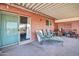 Covered patio with seating area and access to interior at 9912 N 97Th Dr # B, Peoria, AZ 85345