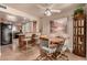 Dining area with round table and kitchen access at 10020 N 109Th Ave, Sun City, AZ 85351