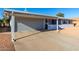 House exterior with carport and well-maintained landscaping at 10020 N 109Th Ave, Sun City, AZ 85351