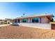 White single story home with a carport at 10020 N 109Th Ave, Sun City, AZ 85351