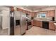 Kitchen with stainless steel appliances and wood cabinets at 10020 N 109Th Ave, Sun City, AZ 85351