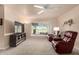 Relaxing living room with leather recliners and golf course view at 10020 N 109Th Ave, Sun City, AZ 85351