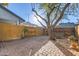 Landscaped backyard with brick patio and wooden fence at 10101 N 91St Ave # 81, Peoria, AZ 85345