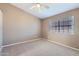 Spacious bedroom with ceiling fan and neutral carpeting at 10101 N 91St Ave # 81, Peoria, AZ 85345