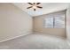 Spacious bedroom with ceiling fan and neutral carpeting at 10101 N 91St Ave # 81, Peoria, AZ 85345