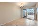 Dining area with tile floors, sliding glass door to patio, and a chandelier at 10101 N 91St Ave # 81, Peoria, AZ 85345