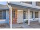 Townhome entrance with brick accents and an ornate security door at 10101 N 91St Ave # 81, Peoria, AZ 85345