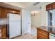 Bright kitchen features granite countertops and oak cabinets at 10101 N 91St Ave # 81, Peoria, AZ 85345