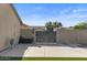 Backyard access with gated entry and concrete area at 10302 E Dolphin Ave, Mesa, AZ 85208