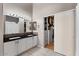 Bathroom with double vanity, large mirror and walk-in closet at 10302 E Dolphin Ave, Mesa, AZ 85208