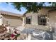 Covered front porch with decorative stone and flowering plants at 10302 E Dolphin Ave, Mesa, AZ 85208