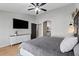 Main bedroom with king-size bed and built-in dresser at 10302 E Dolphin Ave, Mesa, AZ 85208