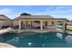 Relaxing backyard with pool, patio, and covered seating at 10302 E Dolphin Ave, Mesa, AZ 85208