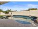 Inviting kidney-shaped pool with rock waterfall feature at 10302 E Dolphin Ave, Mesa, AZ 85208