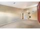 Bright living room featuring neutral carpet and ceiling fan at 10626 E Voax Dr, Sun Lakes, AZ 85248