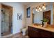 Elegant bathroom with a walk-in shower and double vanity at 10712 E Greythorn Dr, Scottsdale, AZ 85262