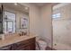 Bathroom with walk-in shower and updated vanity at 10712 E Greythorn Dr, Scottsdale, AZ 85262