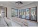 Bedroom with king-size bed and French doors leading to pool at 10712 E Greythorn Dr, Scottsdale, AZ 85262