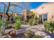 Attractive landscaping and architectural details of a stunning luxury home at 10712 E Greythorn Dr, Scottsdale, AZ 85262