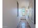 Bright hallway with arched windows and art at 10712 E Greythorn Dr, Scottsdale, AZ 85262