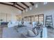 Spacious living room with high ceilings, exposed beams, and tiled floors at 10712 E Greythorn Dr, Scottsdale, AZ 85262