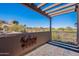 Covered patio with mountain views and wrought iron railing at 10712 E Greythorn Dr, Scottsdale, AZ 85262