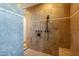 Large shower with multiple shower heads and tile surround at 10712 E Greythorn Dr, Scottsdale, AZ 85262