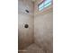 Walk-in shower with tile surround at 10712 E Greythorn Dr, Scottsdale, AZ 85262