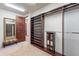 Large walk-in closet with custom shelving and mirror at 10712 E Greythorn Dr, Scottsdale, AZ 85262