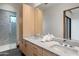 Modern bathroom with double vanity and marble countertops at 11952 E Casitas Del Rio Dr, Scottsdale, AZ 85255