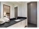 Contemporary bathroom with dark countertop and walk-in shower at 11952 E Casitas Del Rio Dr, Scottsdale, AZ 85255