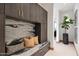 Elegant entryway with built-in bench and marble backsplash at 11952 E Casitas Del Rio Dr, Scottsdale, AZ 85255