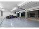 Modern three-car garage with polished floor at 11952 E Casitas Del Rio Dr, Scottsdale, AZ 85255