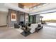 Living room with fireplace and sliding doors to patio at 11952 E Casitas Del Rio Dr, Scottsdale, AZ 85255