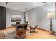 Bright home office with wood flooring and modern furniture at 11952 E Casitas Del Rio Dr, Scottsdale, AZ 85255