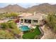 Luxury home with a pool, mountain views, and a spacious backyard at 12026 N 138Th St, Scottsdale, AZ 85259