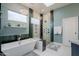 Elegant bathroom with soaking tub, walk-in shower, and modern fixtures at 12026 N 138Th St, Scottsdale, AZ 85259