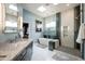 Elegant bathroom with a large soaking tub, walk-in shower, and modern vanity at 12026 N 138Th St, Scottsdale, AZ 85259