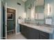 Bathroom with dual sinks, granite countertop and a large mirror at 12026 N 138Th St, Scottsdale, AZ 85259