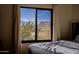 Bedroom with stunning mountain views from large windows at 12026 N 138Th St, Scottsdale, AZ 85259