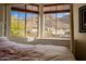 Bedroom with serene mountain views from large windows at 12026 N 138Th St, Scottsdale, AZ 85259