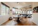 Open dining area with hardwood floors and modern light fixture at 12026 N 138Th St, Scottsdale, AZ 85259