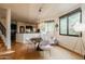 Bright dining area with a round table and modern chairs, offering views to the kitchen and backyard at 12026 N 138Th St, Scottsdale, AZ 85259