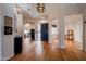 Bright and spacious entryway with hardwood floors and a modern chandelier at 12026 N 138Th St, Scottsdale, AZ 85259