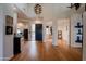 Bright and spacious entryway with hardwood floors and a modern chandelier at 12026 N 138Th St, Scottsdale, AZ 85259